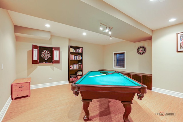 rec room featuring recessed lighting, wood finished floors, baseboards, and built in features