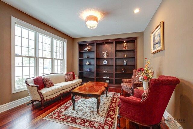 sitting room featuring recessed lighting, baseboards, and wood finished floors