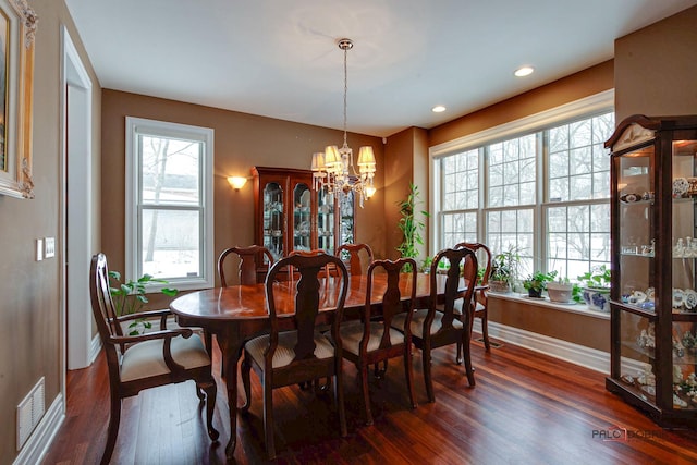 dining room with visible vents, baseboards, recessed lighting, dark wood-style flooring, and a notable chandelier