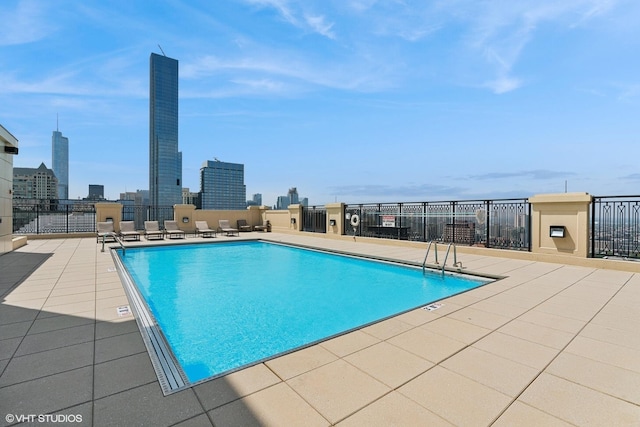 view of swimming pool with a patio area