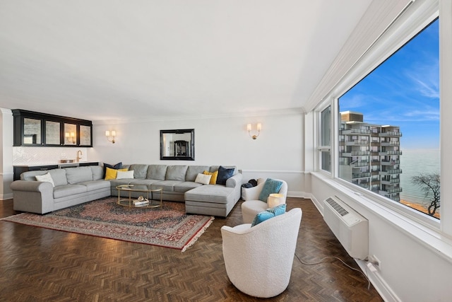 living room featuring a wall mounted AC and baseboards