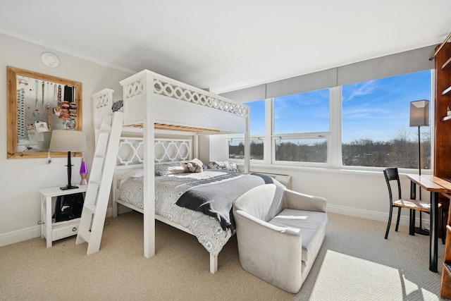 carpeted bedroom with baseboards