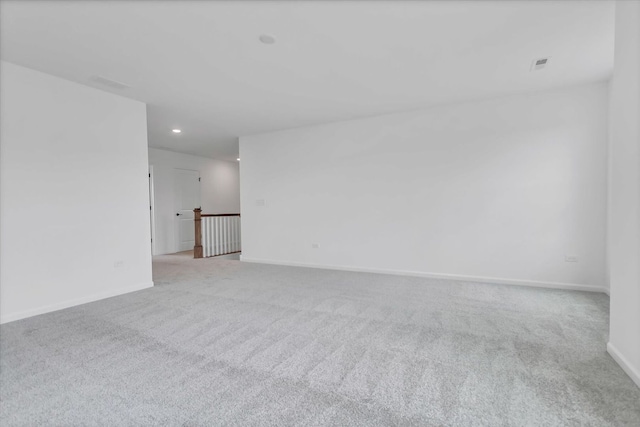 unfurnished room with light colored carpet