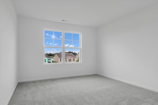 unfurnished room featuring carpet