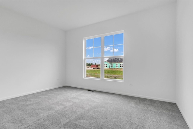 empty room featuring light colored carpet