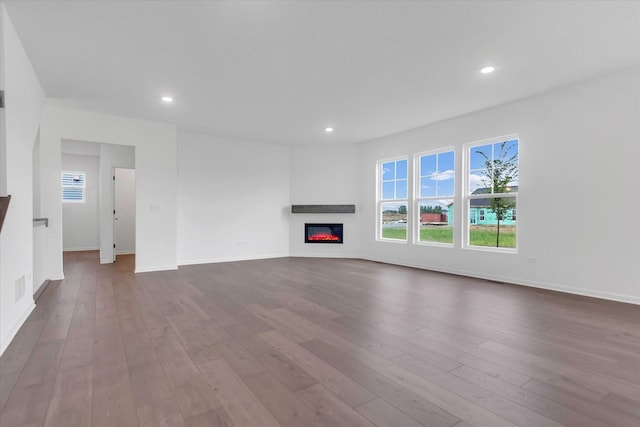 unfurnished living room with hardwood / wood-style floors