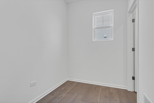 empty room with wood-type flooring