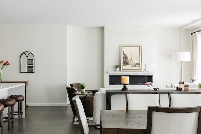 dining room with dark hardwood / wood-style flooring