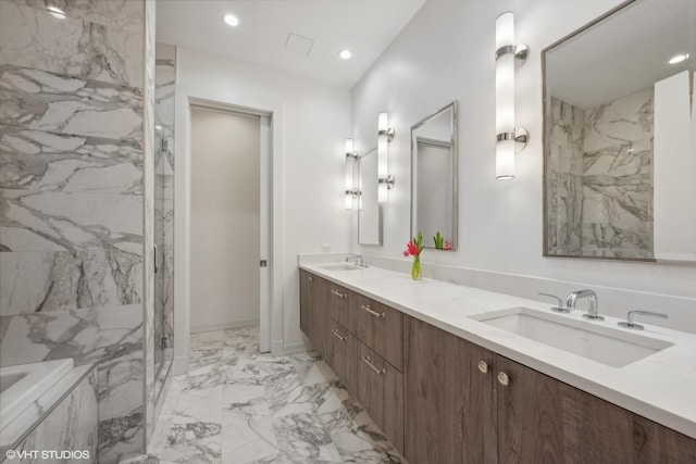 bathroom with vanity and tiled shower