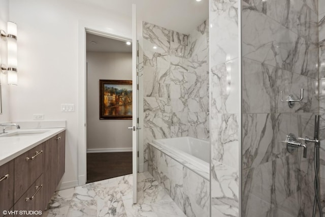 bathroom with vanity and shower with separate bathtub