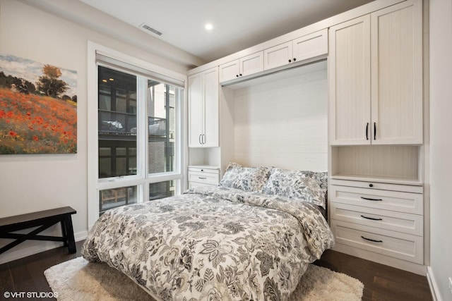 bedroom featuring dark wood-type flooring