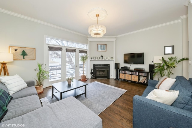 living room with ornamental molding and dark hardwood / wood-style floors