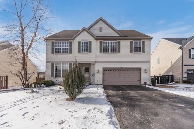 view of front of property featuring driveway and an attached garage