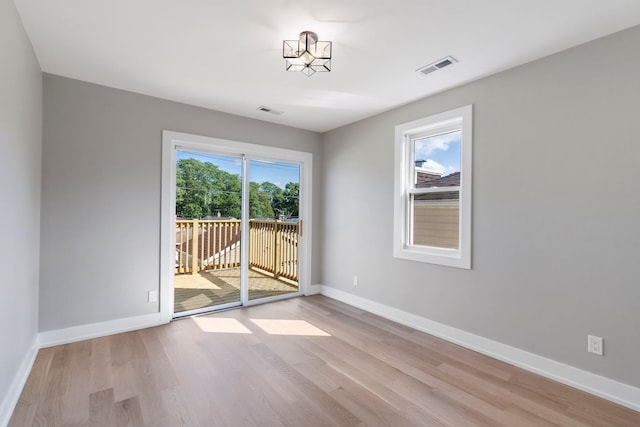 unfurnished room featuring light hardwood / wood-style flooring