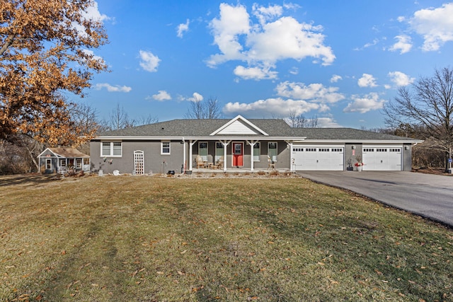 ranch-style home featuring a garage, a front yard, and covered porch