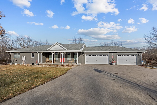 single story home featuring a porch, a garage, and a front lawn