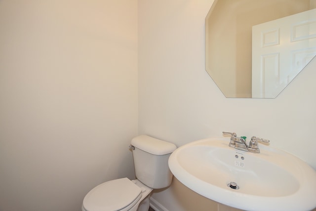 bathroom with sink and toilet