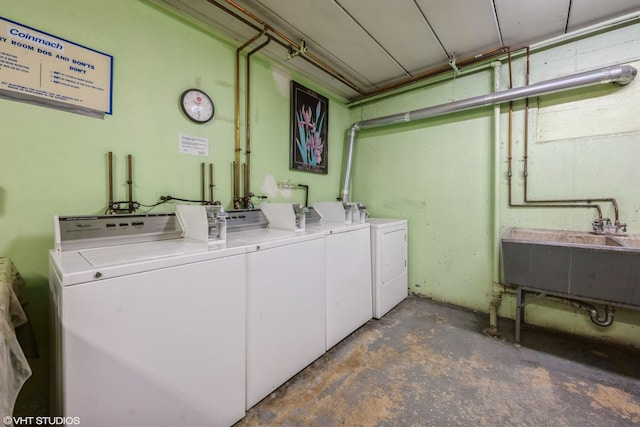 laundry room with sink and washing machine and clothes dryer