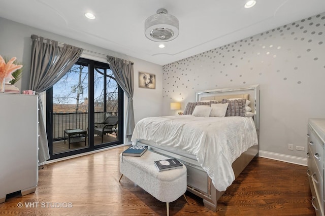 bedroom with dark wood-type flooring and access to outside