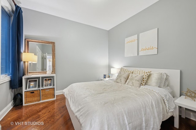 bedroom featuring dark hardwood / wood-style floors