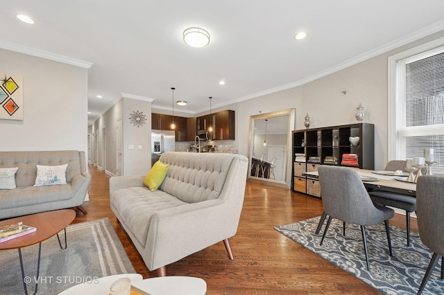 living room featuring crown molding and wood-type flooring