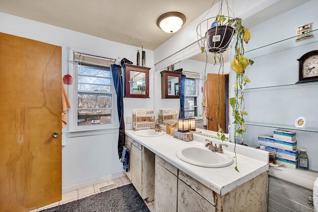 bathroom with vanity and tile patterned flooring