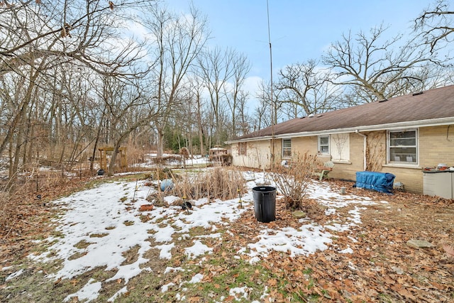 view of yard covered in snow