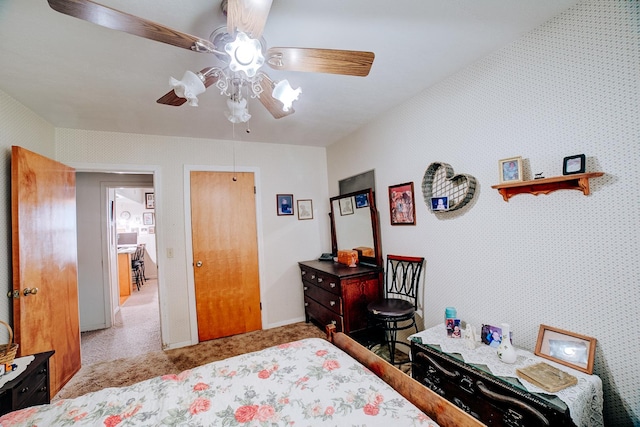 bedroom with ceiling fan and light colored carpet