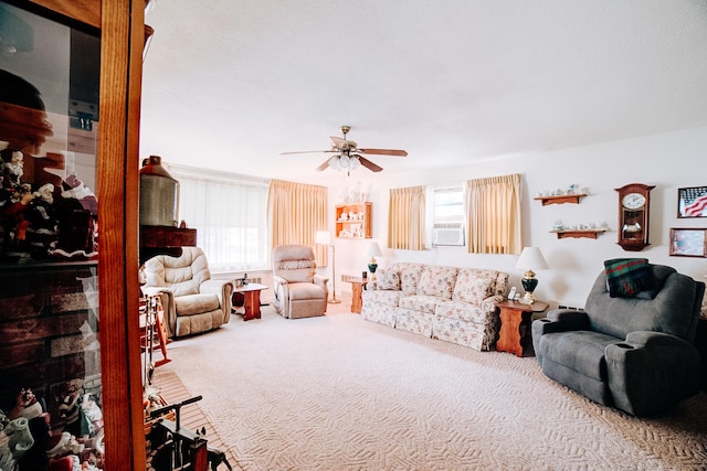 carpeted living room featuring ceiling fan and a healthy amount of sunlight