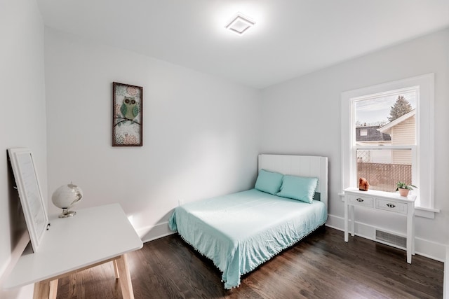 bedroom featuring dark wood-type flooring