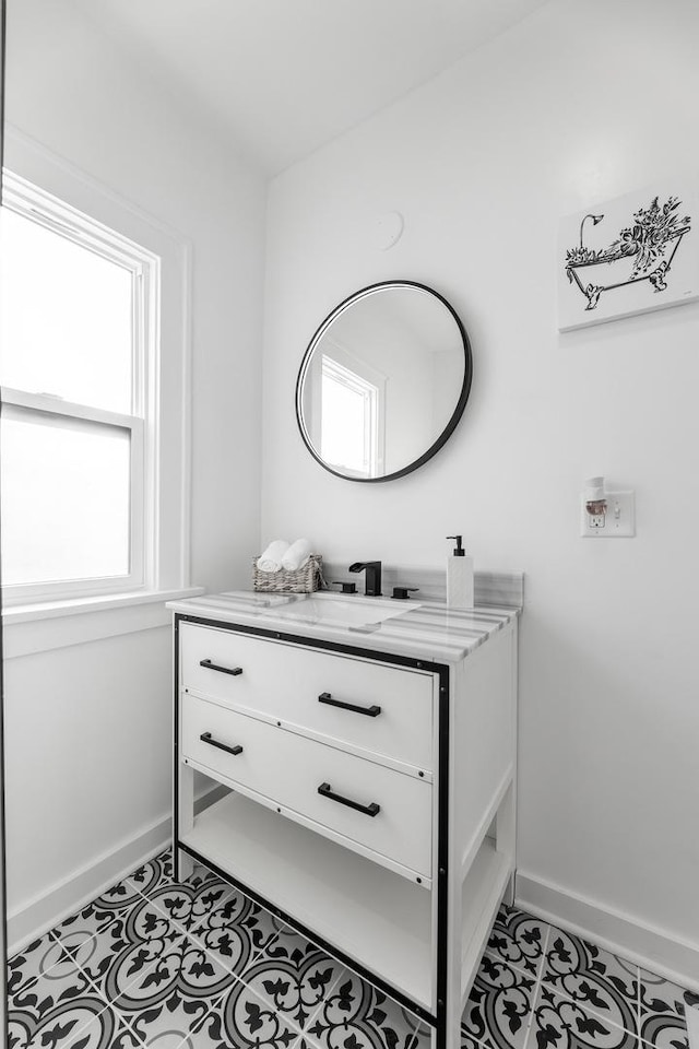 bathroom with tile patterned flooring and vanity