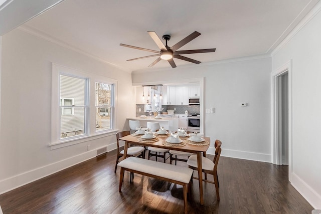 dining area with ornamental molding, dark wood-type flooring, and ceiling fan