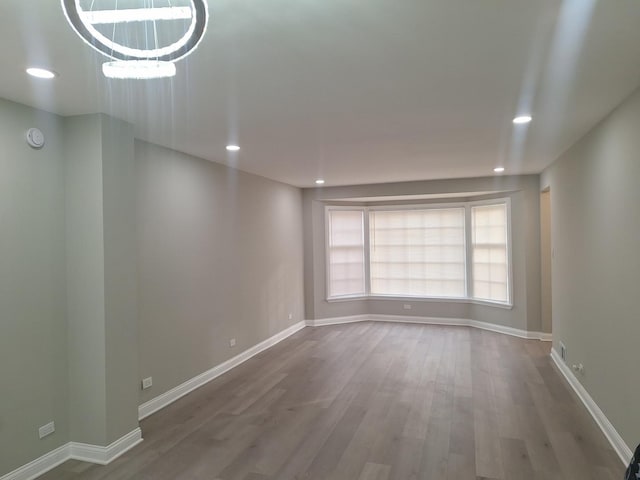 empty room with wood-type flooring