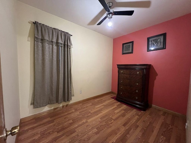 unfurnished bedroom with hardwood / wood-style flooring and ceiling fan