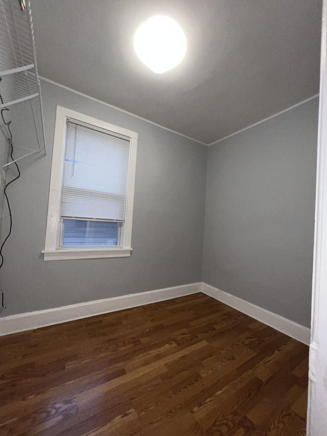 unfurnished room with dark hardwood / wood-style floors