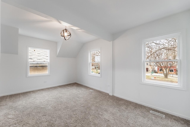 bonus room featuring carpet floors and plenty of natural light