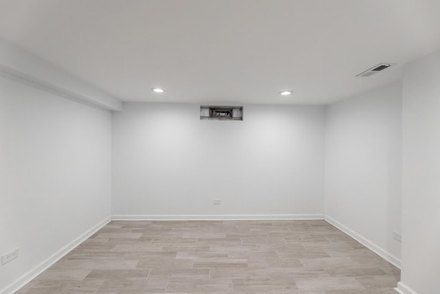 basement featuring light hardwood / wood-style floors