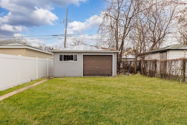 view of yard with a garage and an outdoor structure