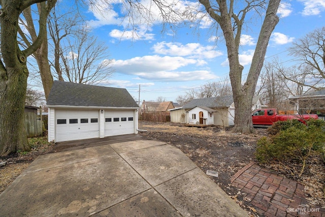 view of property exterior with an outbuilding and a garage