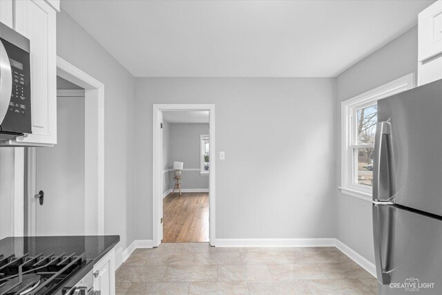 bathroom featuring vanity, toilet, and tile patterned flooring