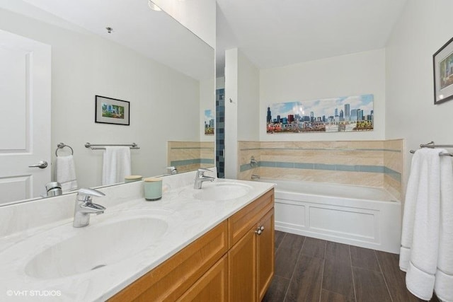 bathroom featuring vanity and a tub to relax in