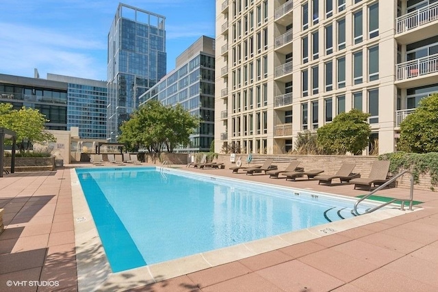 view of swimming pool with a patio area