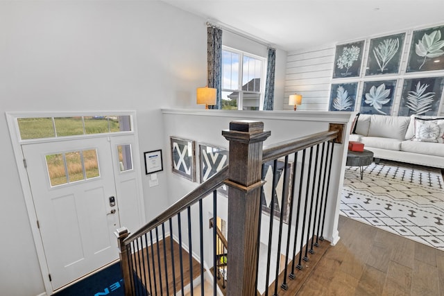 stairs with hardwood / wood-style flooring