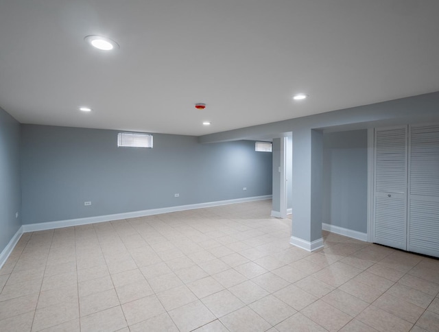 basement with light tile patterned flooring