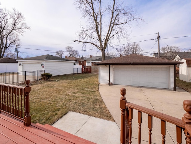 view of yard with a garage and an outdoor structure