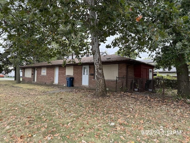 view of property exterior featuring a lawn