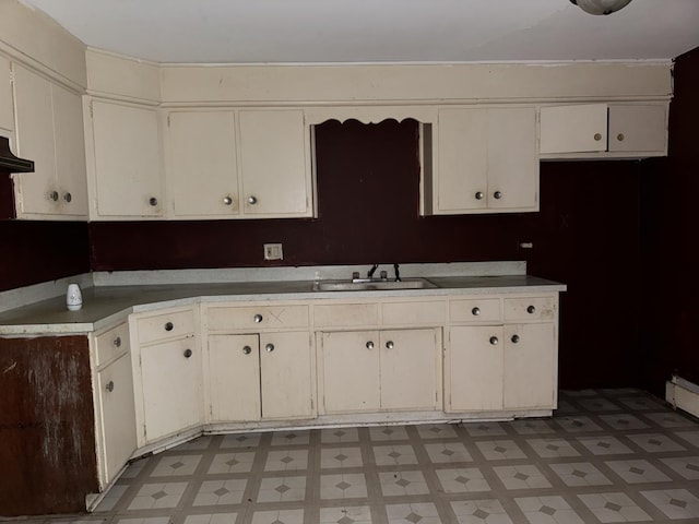 kitchen with white cabinetry and sink