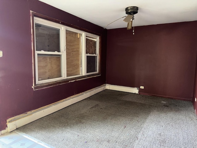 empty room with carpet and ceiling fan