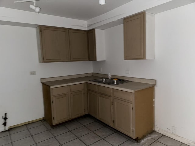 kitchen with sink and light tile patterned floors