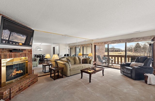 carpeted living room featuring a brick fireplace and a textured ceiling